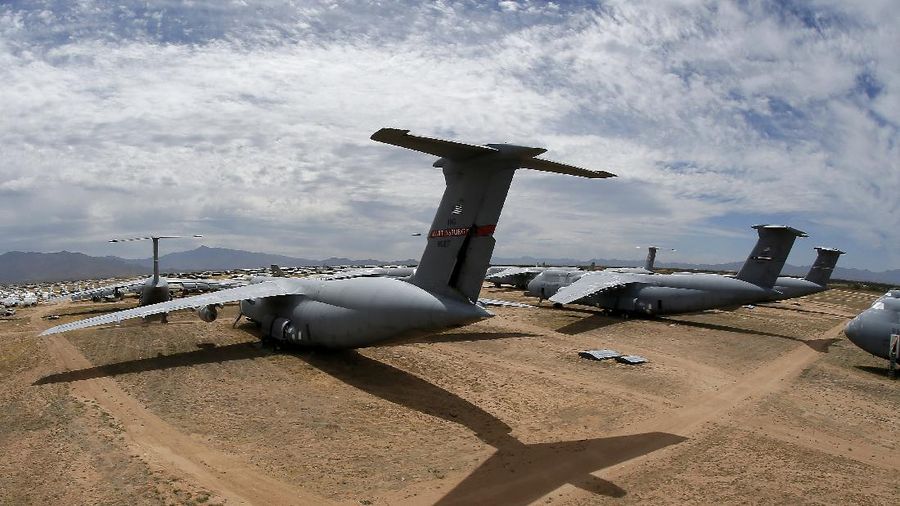 Lockheed C-5 Galaxy cargo jets are stored, as shown with this fisheye lens photograph, at the 309th Aerospace Maintenance and Regeneration Group boneyard Thursday, May 14, 2015 at Davis-Monthan Air Force Base in Tucson, Ariz. The C-5A Galaxy the largest aircraft in the U.S. armed services. (File Photo/AP Photo/Matt York)