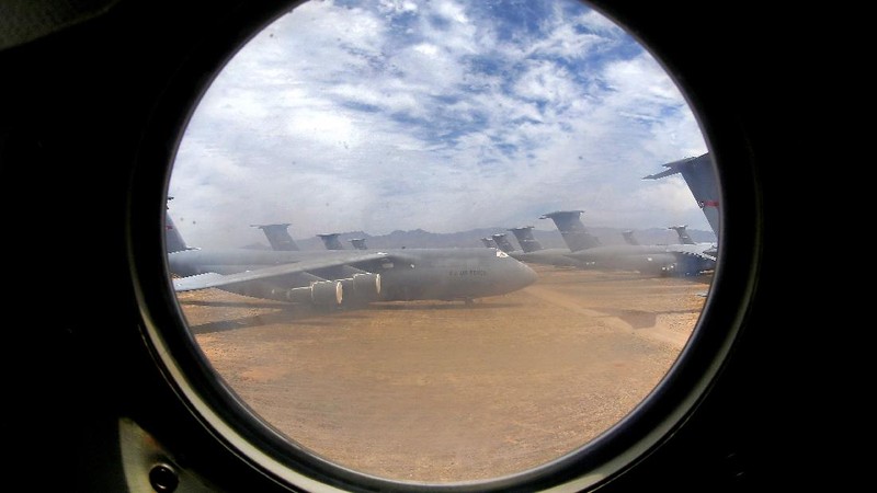 Lockheed C-5 Galaxy cargo jets are stored, as shown with this fisheye lens photograph, at the 309th Aerospace Maintenance and Regeneration Group boneyard Thursday, May 14, 2015 at Davis-Monthan Air Force Base in Tucson, Ariz. The C-5A Galaxy the largest aircraft in the U.S. armed services. (File Photo/AP Photo/Matt York)