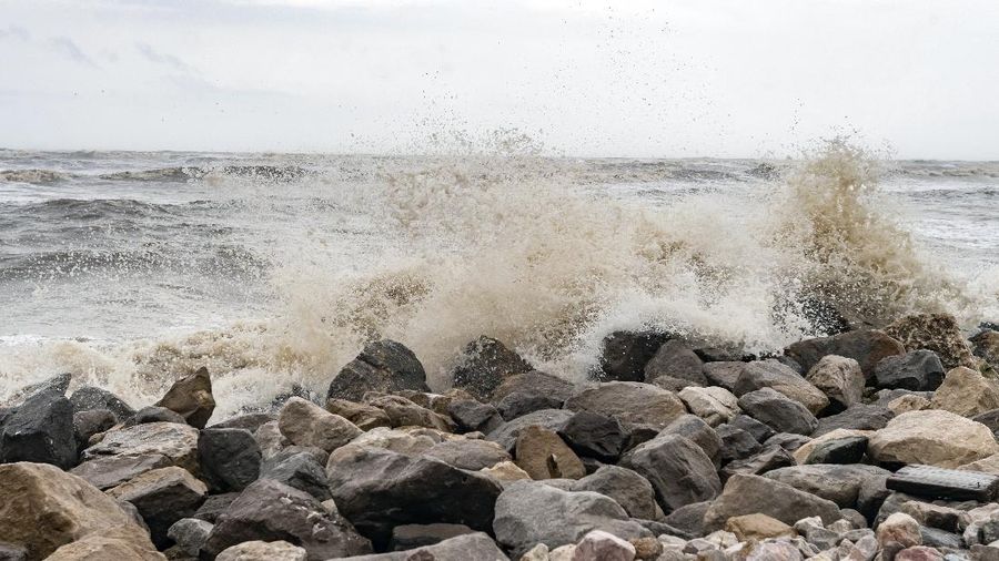 A boat sinks in the Packery Channel during Hurricane Hanna, Saturday, July 25, 2020, in North Padre Island, Texas. The Category 1 storm continued to strengthen before reaching Padre Island at 5 p.m. Saturday. (Annie Rice/Corpus Christi Caller-Times via AP)