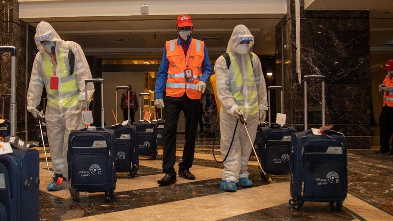 Pilgrims arrive to King Abdulaziz Airport for the Hajj pilgrimage to Mecca, in Jeddah, Saudi Arabia, Saturday, July 25, 2020. Saudi Arabia issued guidelines for about 1,000 pilgrims who will be allowed to perform the hajj pilgrimage in Mecca later this month (Saudi Ministry of Media via AP)