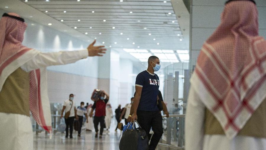 Pilgrims arrive to King Abdulaziz Airport for the Hajj pilgrimage to Mecca, in Jeddah, Saudi Arabia, Saturday, July 25, 2020. Saudi Arabia issued guidelines for about 1,000 pilgrims who will be allowed to perform the hajj pilgrimage in Mecca later this month (Saudi Ministry of Media via AP)