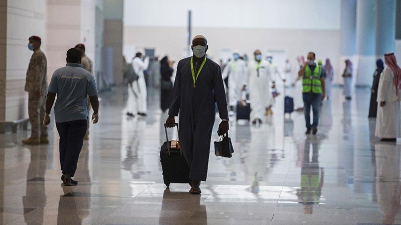 Pilgrims arrive to King Abdulaziz Airport for the Hajj pilgrimage to Mecca, in Jeddah, Saudi Arabia, Saturday, July 25, 2020. Saudi Arabia issued guidelines for about 1,000 pilgrims who will be allowed to perform the hajj pilgrimage in Mecca later this month (Saudi Ministry of Media via AP)