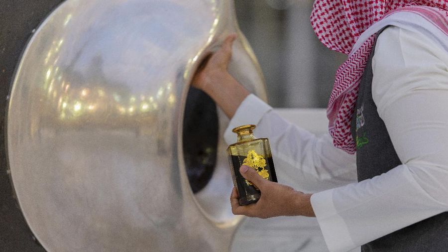 Workers disinfect the ground outside the Grand Mosque, over fears of the new coronavirus, at the Muslim holy city of Mecca, Saudi Arabia, Monday, July 27, 2020. Anywhere from 1,000 to 10,000 pilgrims will be allowed to perform the annual hajj pilgrimage this year due to the coronavirus pandemic. (AP Photo)