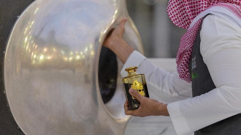 Workers disinfect the ground outside the Grand Mosque, over fears of the new coronavirus, at the Muslim holy city of Mecca, Saudi Arabia, Monday, July 27, 2020. Anywhere from 1,000 to 10,000 pilgrims will be allowed to perform the annual hajj pilgrimage this year due to the coronavirus pandemic. (AP Photo)