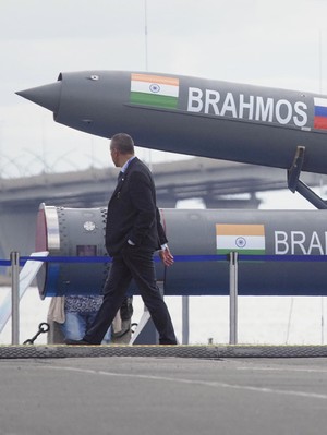 Visitors walk past an Indian Brahmos anti-ship missile at the International Maritime Defence show in St.Petersburg, Russia, Thursday, July 11, 2019. (AP Photo/Dmitri Lovetsky)