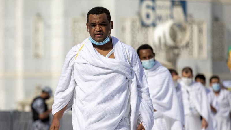 In this photo released by the Saudi Media Ministry, a limited numbers of pilgrims move several feet apart, circling the cube-shaped Kaaba in the first rituals of the hajj, as they keep social distancing to limit exposure and the potential transmission of the coronavirus, at the Grand Mosque in the Muslim holy city of Mecca, Saudi Arabia, Wednesday, July 29, 2020. The hajj, which started on Wednesday, is intended to bring about greater humility and unity among Muslims. (Saudi Media Ministry via AP)