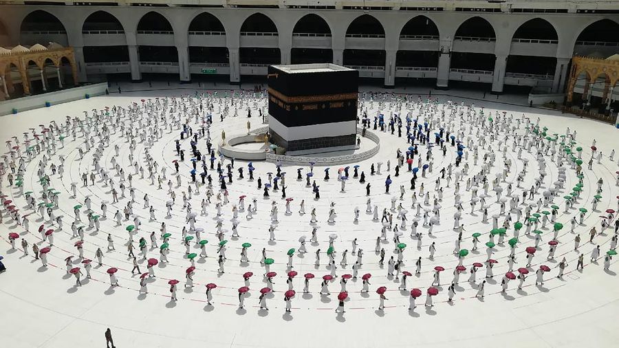 Hundreds of Muslim pilgrims circle the Kaaba, the cubic building at the Grand Mosque, as they keep social destination to protect themselves against the coronavirus ahead of the Hajj pilgrimage in the Muslim holy city of Mecca, Saudi Arabia, Wednesday, July 29, 2020. During the first rites of hajj, Muslims circle the Kaaba counter-clockwise seven times while reciting supplications to God, then walk between two hills where Ibrahim's wife, Hagar, is believed to have run as she searched for water for her dying son before God brought forth a well that runs to this day. (AP Photo)
