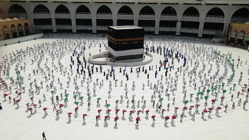 Pilgrims arrive to King Abdulaziz Airport for the Hajj pilgrimage to Mecca, in Jeddah, Saudi Arabia, Saturday, July 25, 2020. (Saudi Ministry of Media via AP)