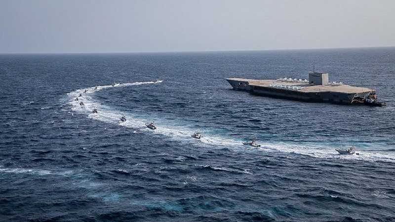 In this photo released Tuesday, July 28, 2020, by Sepahnews, a Revolutionary Guard's speed boat fires a missile during a military exercise. Iranian commandos also fast-roped down from a helicopter onto a replica of an aircraft carrier in the exercise called 