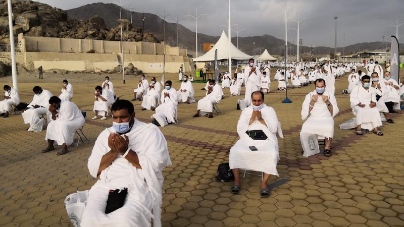 Muslim pilgrims pray near the Mercy mountain in Arafat as they distance themselves to protect against coronavirus during the annual hajj pilgrimage near the holy city of Mecca, Saudi Arabia, Thursday, July 30, 2020. This year's hajj was dramatically scaled down from 2.5 million pilgrims to as few as 1,000 due to the coronavirus pandemic. (AP Photo)
