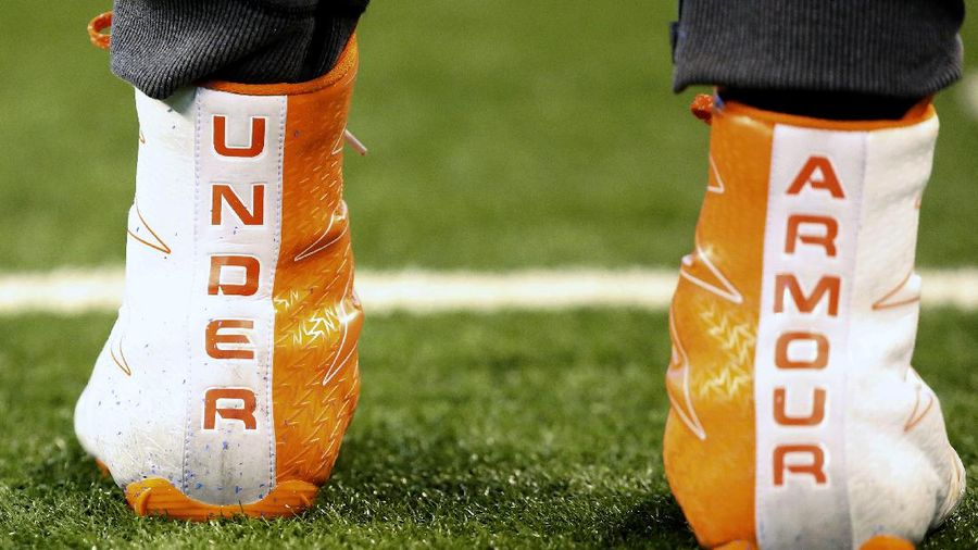 FILE- In this March 5, 2017, file photo a closeup of Under Armour cleats are seen before a drill at the 2017 NFL football scouting combine in Indianapolis. Under Armour received a warning from U.S. regulators that the company and two executives could be punished over past accounting practices. The sporting goods company said in a government filing Monday, July 27, 2020, that the warning, known as a “Wells Notice,” was sent last week from the U.S. Securities and Exchange Commission.  (AP Photo/Gregory Payan, File)