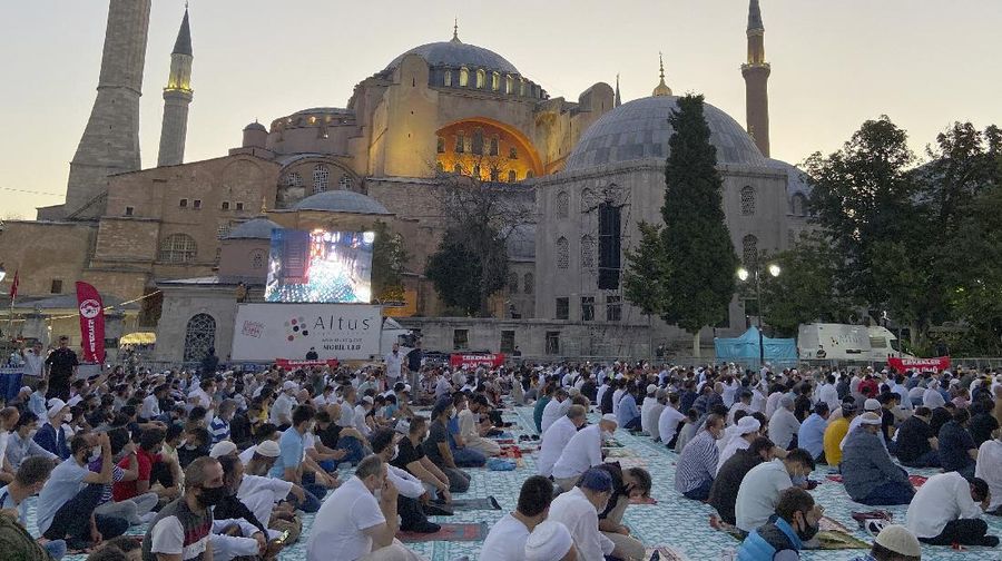 Hundreds of faithful gather early in the morning outside Istanbul's iconic Hagia Sophia for Eid-al Adha prayers, in Istanbul, Friday, July 31, 2020. Small groups of pilgrims performed one of the final rites of the Islamic hajj on Friday as Muslims worldwide marked the start of the Eid al-Adha holiday amid a global pandemic that has impacted nearly every aspect of this year’s pilgrimage and celebrations. The last days of hajj coincide with the four-day Eid al-Adha, or “Feast of Sacrifice,” in which Muslims slaughter livestock and distribute the meat to the poor. (AP Photo/Cavit Ozgul)