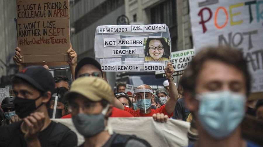 A coalition of teachers, students, and families protest during a rally called National Day of Resistance Against Unsafe School Reopening Opening, Monday, Aug. 3, 2020, in New York. Organizers said New York Governor Andrew Cuomo, New York Mayor Bill DeBlasio, Chancellor Richard Carranza, and the Department of Education must stop the in-person reopening of schools until it is safe for all. (AP Photo/Bebeto Matthews)