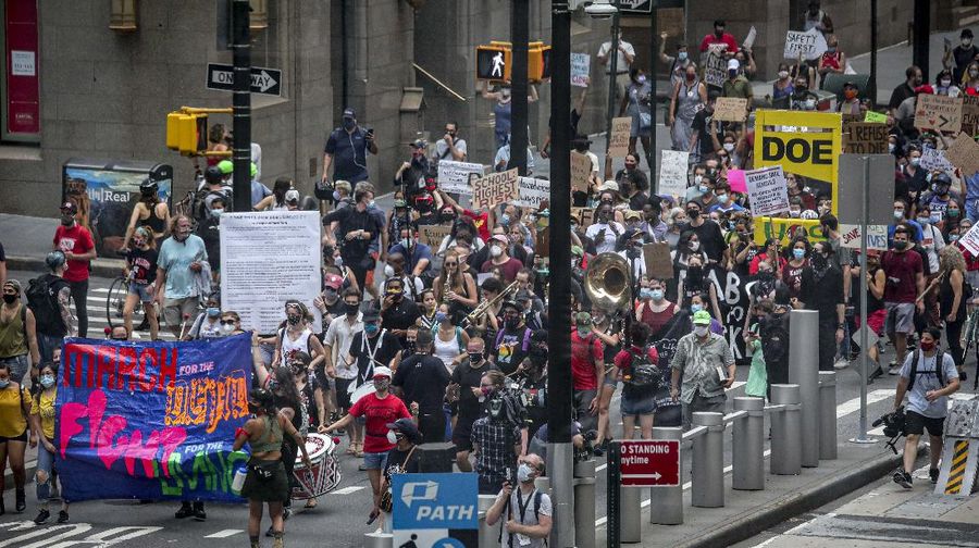 A coalition of teachers, students, and families protest during a rally called National Day of Resistance Against Unsafe School Reopening Opening, Monday, Aug. 3, 2020, in New York. Organizers said New York Governor Andrew Cuomo, New York Mayor Bill DeBlasio, Chancellor Richard Carranza, and the Department of Education must stop the in-person reopening of schools until it is safe for all. (AP Photo/Bebeto Matthews)