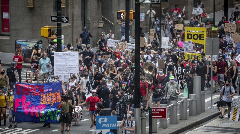 A coalition of teachers, students, and families protest during a rally called National Day of Resistance Against Unsafe School Reopening Opening, Monday, Aug. 3, 2020, in New York. Organizers said New York Governor Andrew Cuomo, New York Mayor Bill DeBlasio, Chancellor Richard Carranza, and the Department of Education must stop the in-person reopening of schools until it is safe for all. (AP Photo/Bebeto Matthews)