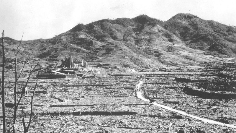 FILE  - In this Aug. 9, 1945, file photo, a giant column of smoke rises after the second atomic bomb ever used in warfare explodes over the Japanese port town of Nagasaki. The city of Nagasaki in southern Japan marks the 75th anniversary of the U.S. atomic bombing of Aug. 9, 1945. Japan surrendered on Aug. 15, ending World War II and its nearly a half-century aggression toward Asian neighbors. Dwindling survivors, whose average age exceeds 83, increasingly worry about passing their lessons on to younger generations. (AP Photo, File)