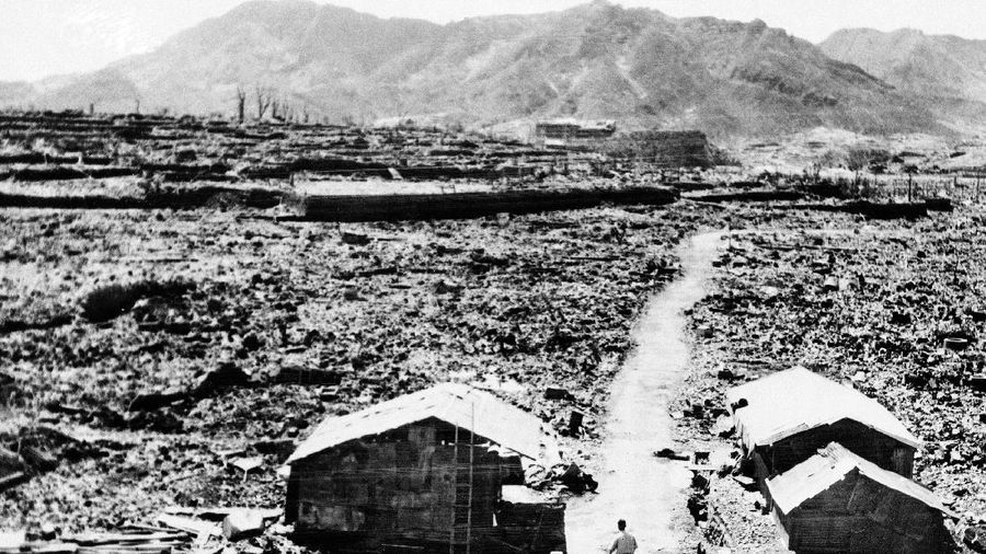 FILE  - In this Aug. 9, 1945, file photo, a giant column of smoke rises after the second atomic bomb ever used in warfare explodes over the Japanese port town of Nagasaki. The city of Nagasaki in southern Japan marks the 75th anniversary of the U.S. atomic bombing of Aug. 9, 1945. Japan surrendered on Aug. 15, ending World War II and its nearly a half-century aggression toward Asian neighbors. Dwindling survivors, whose average age exceeds 83, increasingly worry about passing their lessons on to younger generations. (AP Photo, File)