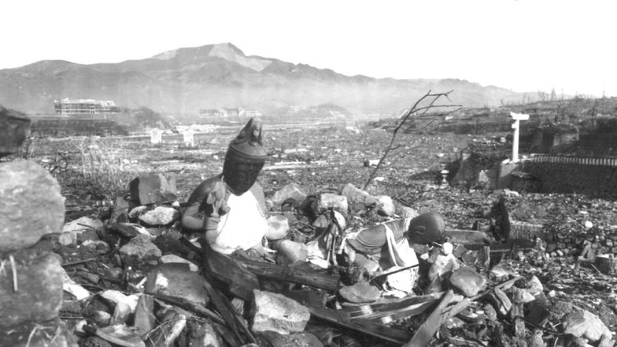 FILE  - In this Aug. 9, 1945, file photo, a giant column of smoke rises after the second atomic bomb ever used in warfare explodes over the Japanese port town of Nagasaki. The city of Nagasaki in southern Japan marks the 75th anniversary of the U.S. atomic bombing of Aug. 9, 1945. Japan surrendered on Aug. 15, ending World War II and its nearly a half-century aggression toward Asian neighbors. Dwindling survivors, whose average age exceeds 83, increasingly worry about passing their lessons on to younger generations. (AP Photo, File)