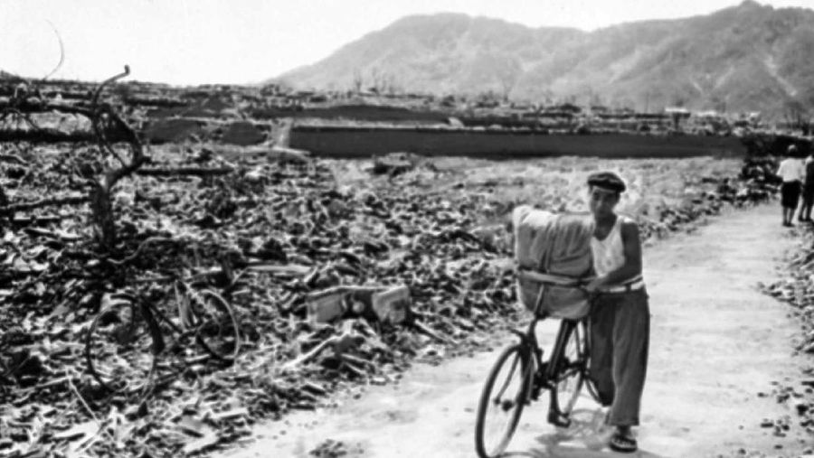 FILE  - In this Aug. 9, 1945, file photo, a giant column of smoke rises after the second atomic bomb ever used in warfare explodes over the Japanese port town of Nagasaki. The city of Nagasaki in southern Japan marks the 75th anniversary of the U.S. atomic bombing of Aug. 9, 1945. Japan surrendered on Aug. 15, ending World War II and its nearly a half-century aggression toward Asian neighbors. Dwindling survivors, whose average age exceeds 83, increasingly worry about passing their lessons on to younger generations. (AP Photo, File)