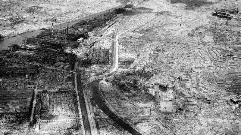 FILE  - In this Aug. 9, 1945, file photo, a giant column of smoke rises after the second atomic bomb ever used in warfare explodes over the Japanese port town of Nagasaki. The city of Nagasaki in southern Japan marks the 75th anniversary of the U.S. atomic bombing of Aug. 9, 1945. Japan surrendered on Aug. 15, ending World War II and its nearly a half-century aggression toward Asian neighbors. Dwindling survivors, whose average age exceeds 83, increasingly worry about passing their lessons on to younger generations. (AP Photo, File)