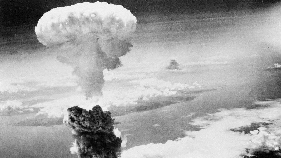 FILE - In this Aug. 9, 1945, file photo, a giant column of smoke rises after the second atomic bomb ever used in warfare explodes over the Japanese port town of Nagasaki. The city of Nagasaki in southern Japan marks the 75th anniversary of the U.S. atomic bombing of Aug. 9, 1945. Japan surrendered on Aug. 15, ending World War II and its nearly a half-century aggression toward Asian neighbors. Dwindling survivors, whose average age exceeds 83, increasingly worry about passing their lessons on to younger generations. (AP Photo, File)