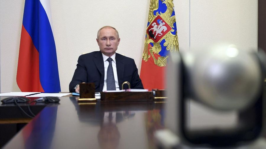 Russian President Vladimir Putin attends a cabinet meeting at the Novo-Ogaryovo residence outside Moscow, Russia, Tuesday, Aug. 11, 2020. Putin says that a coronavirus vaccine developed in the country has been registered for use and one of his daughters has already been inoculated. Speaking at a government meeting Tuesday, Aug. 11, 2020, Putin said that the vaccine has proven efficient during tests, offering a lasting immunity from the coronavirus. (Alexei Nikolsky, Sputnik, Kremlin Pool Photo via AP)