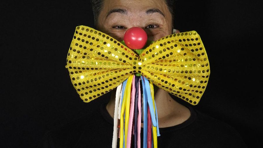This combination of photos shows Edmond Kok, a Hong Kong theater costume designer and actor, wearing a variety of face masks he made to protect against the coronavirus in Hong Kong Thursday, Aug. 6, 2020. With little theater work because of the coronavirus pandemic, Kok has found a way to turn the now ubiquitous face mask into a creative opportunity. Since February, he has created more than 170 face masks inspired both by the pandemic and Hong Kong’s political problems - not for actual use but as pieces of art. (AP Photo/Vincent Yu)