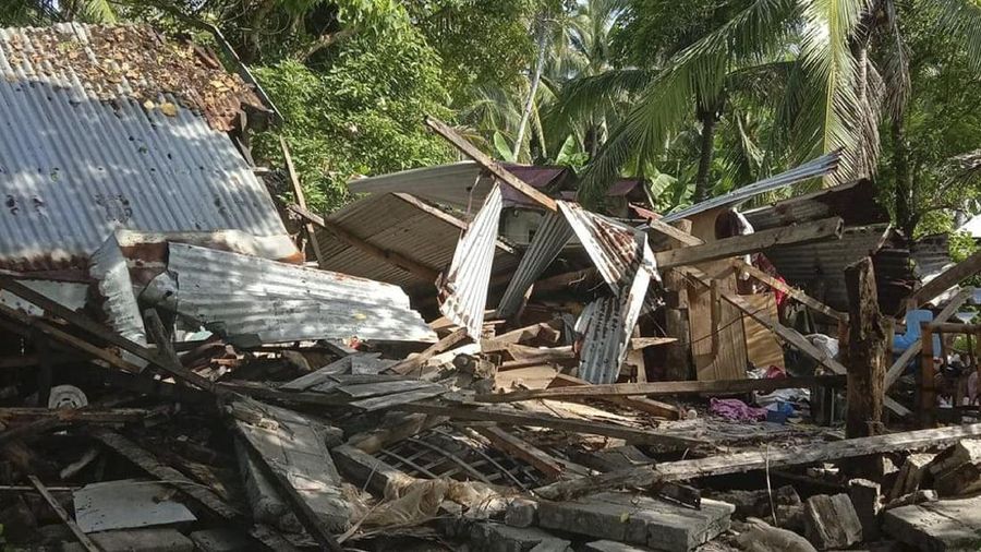 In this photo provided by the Philippine Red Cross, a toppled house is seen after a quake struck in Cataingan, Masbate province, central Philippines on Tuesday Aug. 18, 2020. A powerful and shallow earthquake struck a central Philippine region Tuesday, prompting people to dash out of homes and offices but there were no immediate reports of injuries or major damage. (John Mark Lalaguna/Philippine National Red Cross via AP)