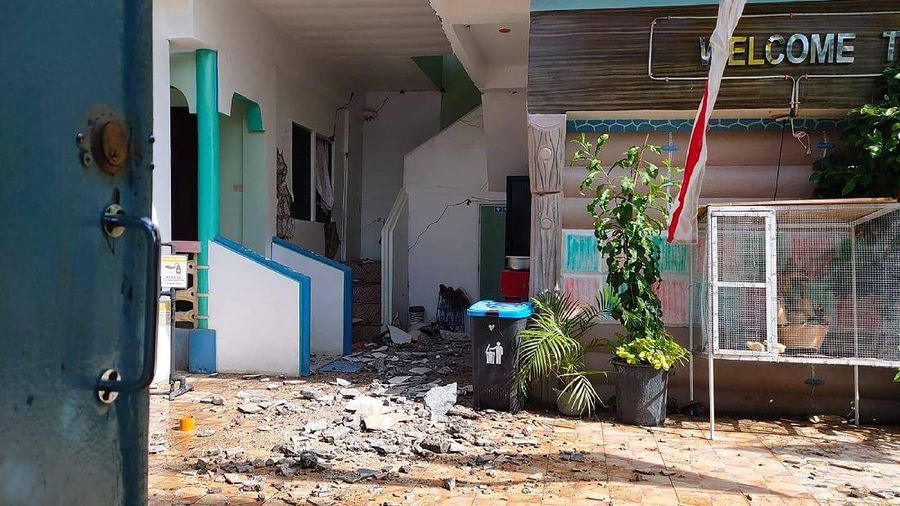 In this photo provided by the Philippine Red Cross, a toppled house is seen after a quake struck in Cataingan, Masbate province, central Philippines on Tuesday Aug. 18, 2020. A powerful and shallow earthquake struck a central Philippine region Tuesday, prompting people to dash out of homes and offices but there were no immediate reports of injuries or major damage. (John Mark Lalaguna/Philippine National Red Cross via AP)
