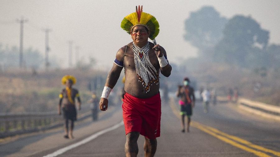 Kayapo Indigenous block highway BR-163y near Novo Progresso, Para state, Brazil, Monday, Aug. 17, 2020. Protesters blocked the road to pressure Brazilian President Jair Bolsonaro to better shield them from COVID-19, to extend damages payments for road construction near their land, and to consult them on a proposed railway to transport soybeans and corn. (AP Photo/Andre Penner)