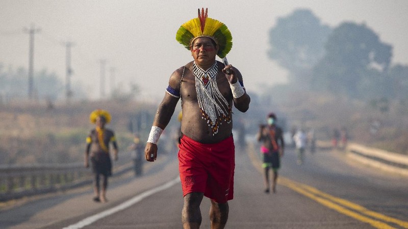 Kayapo Indigenous block highway BR-163y near Novo Progresso, Para state, Brazil, Monday, Aug. 17, 2020. Protesters blocked the road to pressure Brazilian President Jair Bolsonaro to better shield them from COVID-19, to extend damages payments for road construction near their land, and to consult them on a proposed railway to transport soybeans and corn. (AP Photo/Andre Penner)