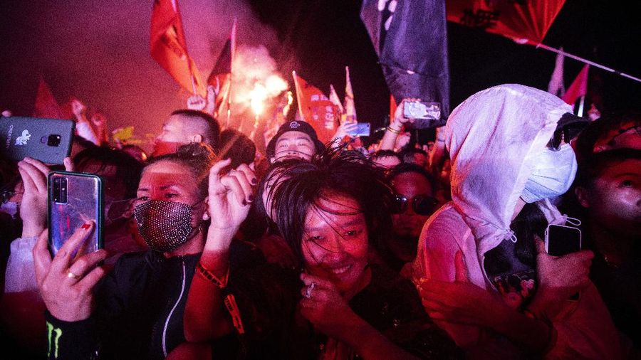 Attendees enjoy themselves during the Hello Chongli-Thaiwoo Midi Music Season held in Chongli in northern China's Hebei Province on Sunday, Aug. 16, 2020. Large scale events are returning with China having contained the coronavirus outbreak with majority of new cases being in travelers arriving from overseas. (AP Photo/Ng Han Guan)