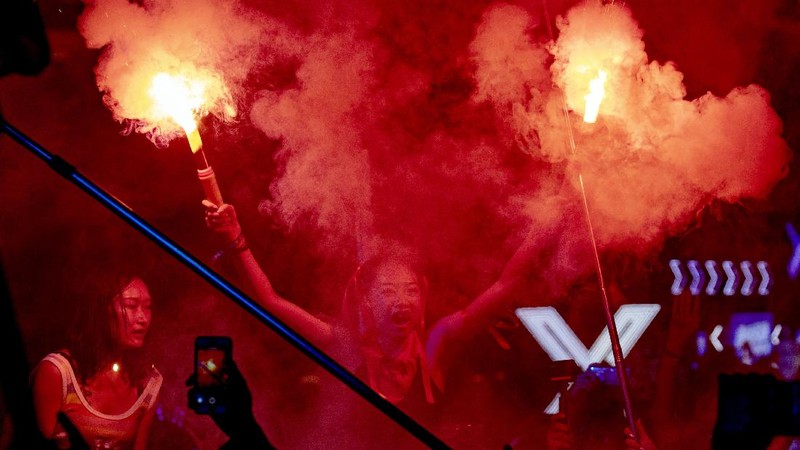 Attendees enjoy themselves during the Hello Chongli-Thaiwoo Midi Music Season held in Chongli in northern China's Hebei Province on Sunday, Aug. 16, 2020. Large scale events are returning with China having contained the coronavirus outbreak with majority of new cases being in travelers arriving from overseas. (AP Photo/Ng Han Guan)