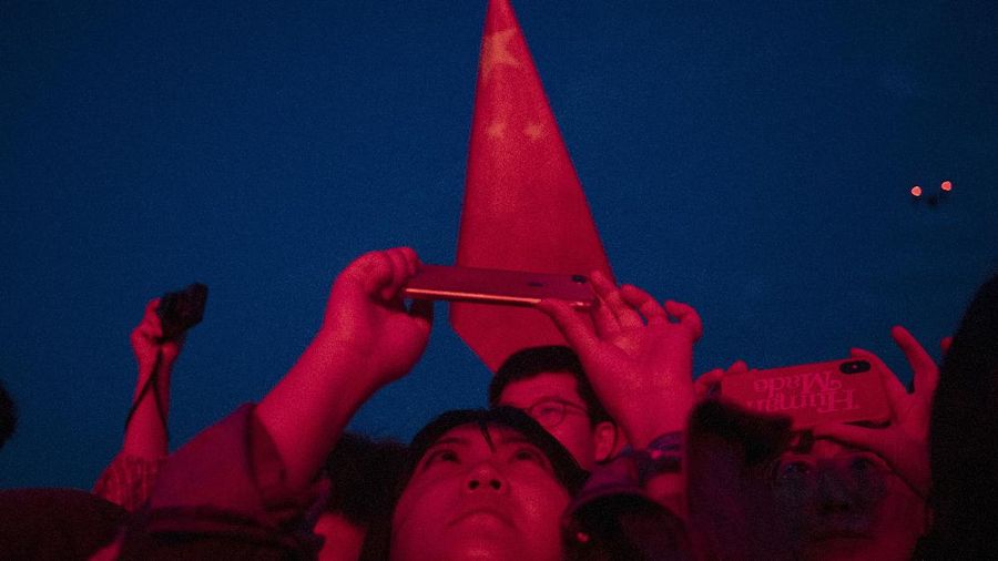 Attendees enjoy themselves during the Hello Chongli-Thaiwoo Midi Music Season held in Chongli in northern China's Hebei Province on Sunday, Aug. 16, 2020. Large scale events are returning with China having contained the coronavirus outbreak with majority of new cases being in travelers arriving from overseas. (AP Photo/Ng Han Guan)