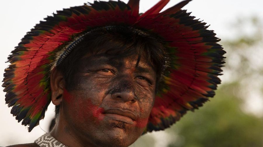 Kayapo men block highway BR-163 in protest, near Novo Progresso, Para state, Brazil, Thursday, Aug. 20, 2020. The protesters blocked the road to pressure Brazilian President Jair Bolsonaro to better protect them from COVID-19, to extend damages payments for road construction near their land, and to consult them on a proposed railway to transport soybeans and corn. (AP Photo/Andre Penner)