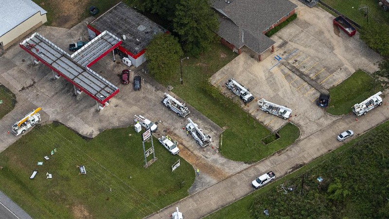 Fallen trees and damaged roofs are left in the aftermath of Hurricane Laura, Friday, Aug. 28, 2020, in DeRidder, La., as seen during Gov. John Bel Edwards' aerial tour of stricken areas in the northern part of the state. (Bill Feig/The Advocate via AP, Pool)