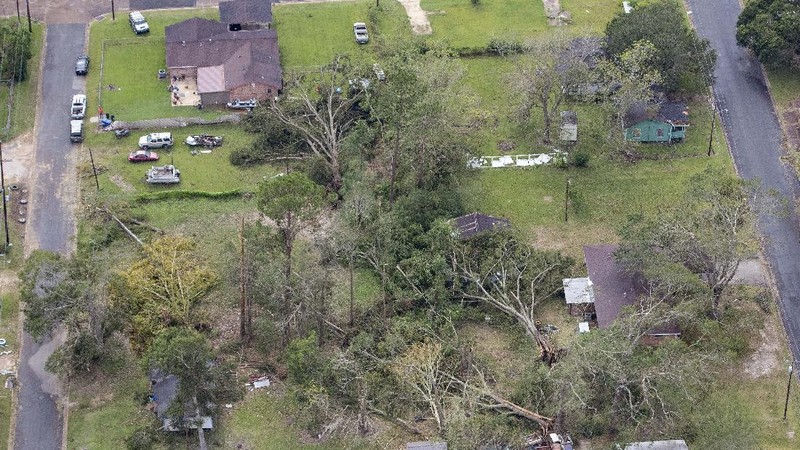 Fallen trees and damaged roofs are left in the aftermath of Hurricane Laura, Friday, Aug. 28, 2020, in DeRidder, La., as seen during Gov. John Bel Edwards' aerial tour of stricken areas in the northern part of the state. (Bill Feig/The Advocate via AP, Pool)