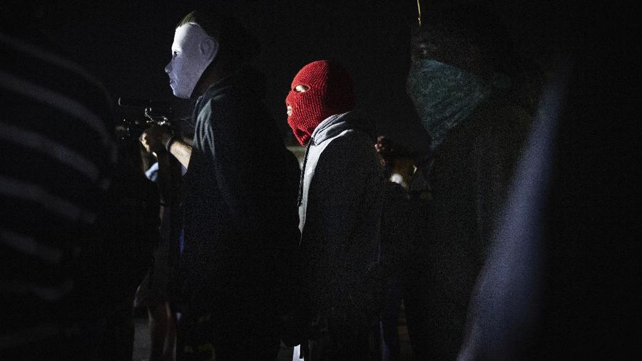 Protesters clash with deputies of the Los Angeles Sheriff's Department during protests following the death of Dijon Kizzee on Monday, Aug. 31, 2020, in Los Angeles, Calif. (AP Photo/Christian Monterrosa)