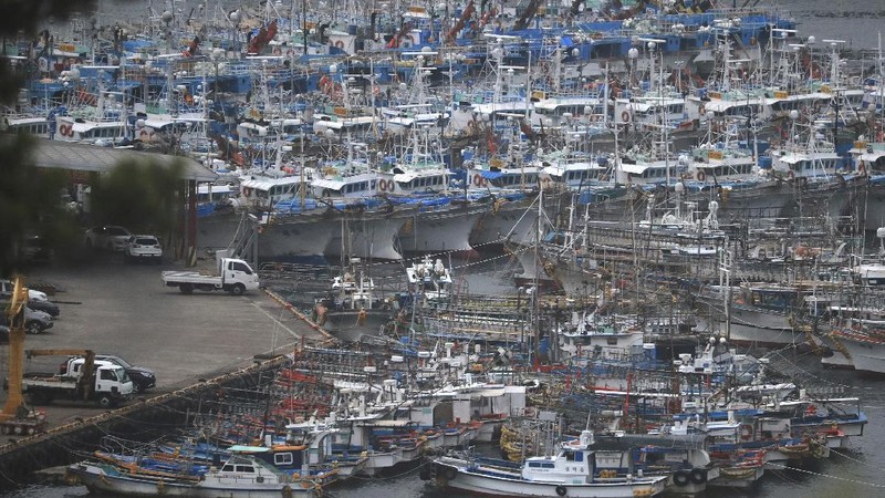 A citizen walks through a flooded area in Gangneung, South Korea, Thursday, Sept. 3, 2020. A powerful typhoon ripped through South Korea’s southern and eastern coasts with tree-snapping winds and flooding rains Thursday, knocking out power to thousands of homes. (Lee Hae-yong/Yonhap via AP)