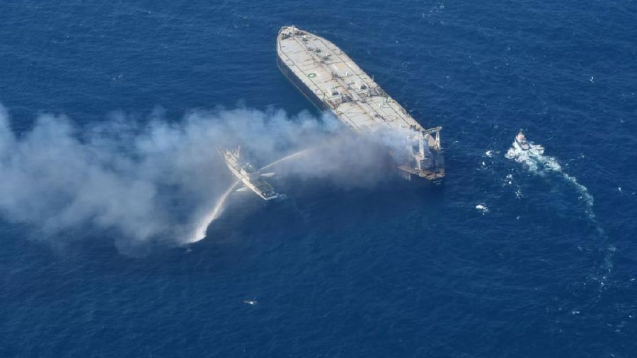 This photo released by Sri Lankan Air Force shows smoke rising after a fire broke out on a Panama-registered oil tanker about 38 nautical miles (70 kilometers) east of Sri Lanka, Thursday, Sept.3, 2020. (Sri Lankan Air Force via AP)