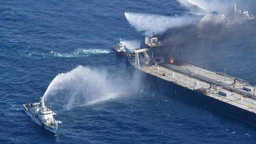 This photo released by Sri Lankan Air Force shows smoke rising after a fire broke out on a Panama-registered oil tanker about 38 nautical miles (70 kilometers) east of Sri Lanka, Thursday, Sept.3, 2020. (Sri Lankan Air Force via AP)