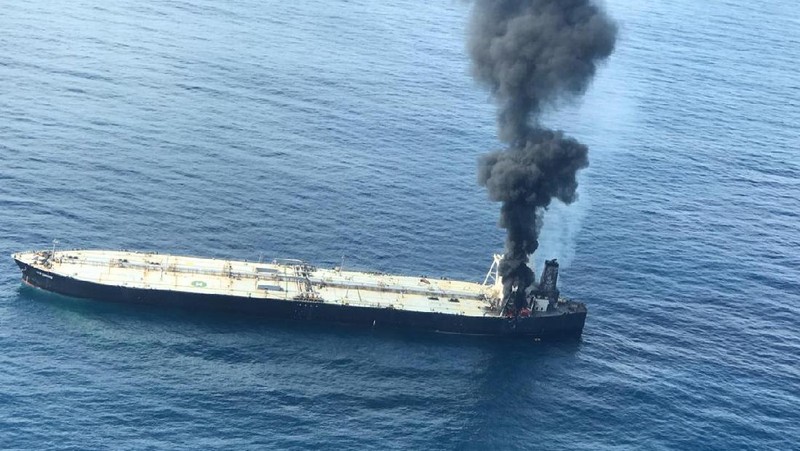 This photo released by Sri Lankan Air Force shows smoke rising after a fire broke out on a Panama-registered oil tanker about 38 nautical miles (70 kilometers) east of Sri Lanka, Thursday, Sept.3, 2020. (Sri Lankan Air Force via AP)
