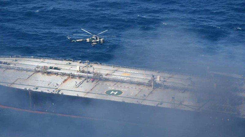 This photo released by Sri Lankan Air Force shows smoke rising after a fire broke out on a Panama-registered oil tanker about 38 nautical miles (70 kilometers) east of Sri Lanka, Thursday, Sept.3, 2020. (Sri Lankan Air Force via AP)