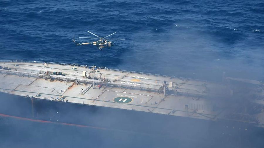 This photo released by Sri Lankan Air Force shows smoke rising after a fire broke out on a Panama-registered oil tanker about 38 nautical miles (70 kilometers) east of Sri Lanka, Thursday, Sept.3, 2020. (Sri Lankan Air Force via AP)