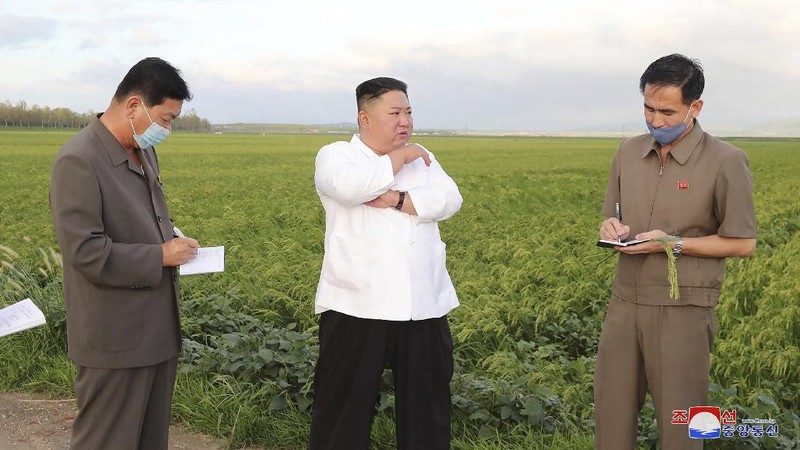 In this Saturday, Sept. 5, 2020, photo provided by the North Korean government, North Korea leader Kim Jong Un talks to officials as he visits a damaged area in the South Hamgyong province, North Korea, following a typhoon known as Maysak. Independent journalists were not given access to cover the event depicted in this image distributed by the North Korean government. The content of this image is as provided and cannot be independently verified. Korean language watermark on image as provided by source reads: 