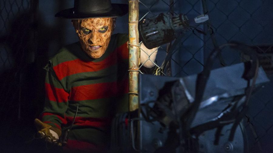An actor dressed as a witch performs at the Hopi Hari horror theme amusement park, in the Vinhedo suburb of Sao Paulo, Brazil, Friday, Sept. 4, 2020. Due to the restrictions caused by COVID-19, the park created a drive-thru tour that allow the public to enjoy the experience by car. (AP Photo/Carla Carniel)