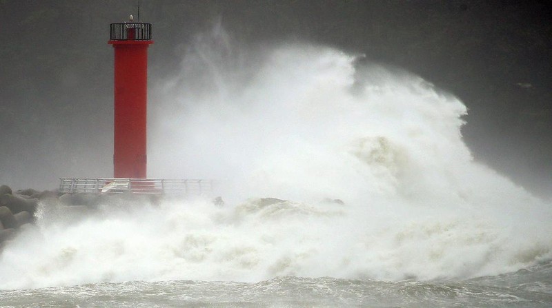 A coastal road is damaged by waves caused by Typhoon Haishen in Ulsan, South Korea, Monday, Sept. 7, 2020. A powerful typhoon damaged buildings, flooded roads and knocked out power to thousands of homes in South Korea on Monday after battering islands in southern Japan and injuring dozens of people. (Kim Yong-tai/Yonhap via AP)