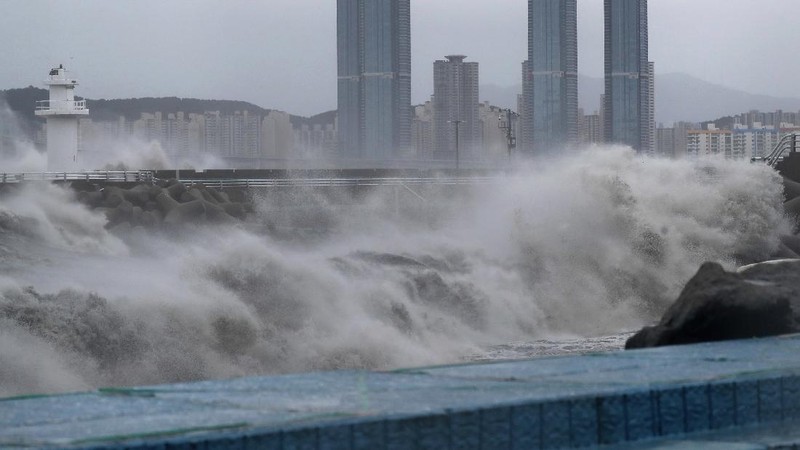 A coastal road is damaged by waves caused by Typhoon Haishen in Ulsan, South Korea, Monday, Sept. 7, 2020. A powerful typhoon damaged buildings, flooded roads and knocked out power to thousands of homes in South Korea on Monday after battering islands in southern Japan and injuring dozens of people. (Kim Yong-tai/Yonhap via AP)