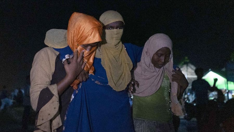 Ethnic Rohingya people rest after the boat carrying them landed in Lhokseumawe, Aceh province, Indonesia, early Monday, Sept. 7, 2020. Almost 300 Rohingya Muslims were found on a beach in Indonesia's Aceh province Monday and were evacuated by military, police and Red Cross volunteers, authorities said. (AP Photo/Rahmat Mirza)