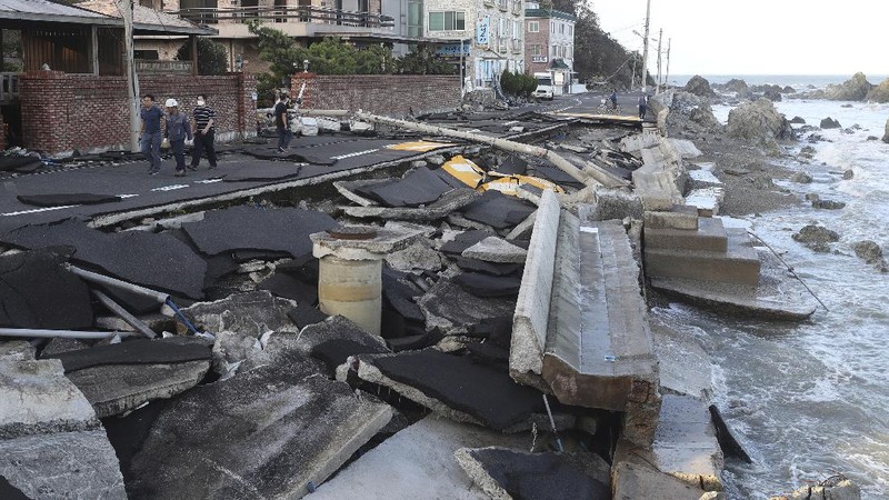 A coastal road is damaged by waves caused by Typhoon Haishen in Ulsan, South Korea, Monday, Sept. 7, 2020. A powerful typhoon damaged buildings, flooded roads and knocked out power to thousands of homes in South Korea on Monday after battering islands in southern Japan and injuring dozens of people. (Kim Yong-tai/Yonhap via AP)